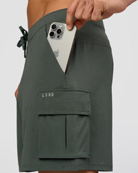 Man wearing Functional Cargo 6" Short - Carbon Green | Model:Albert | Size:M