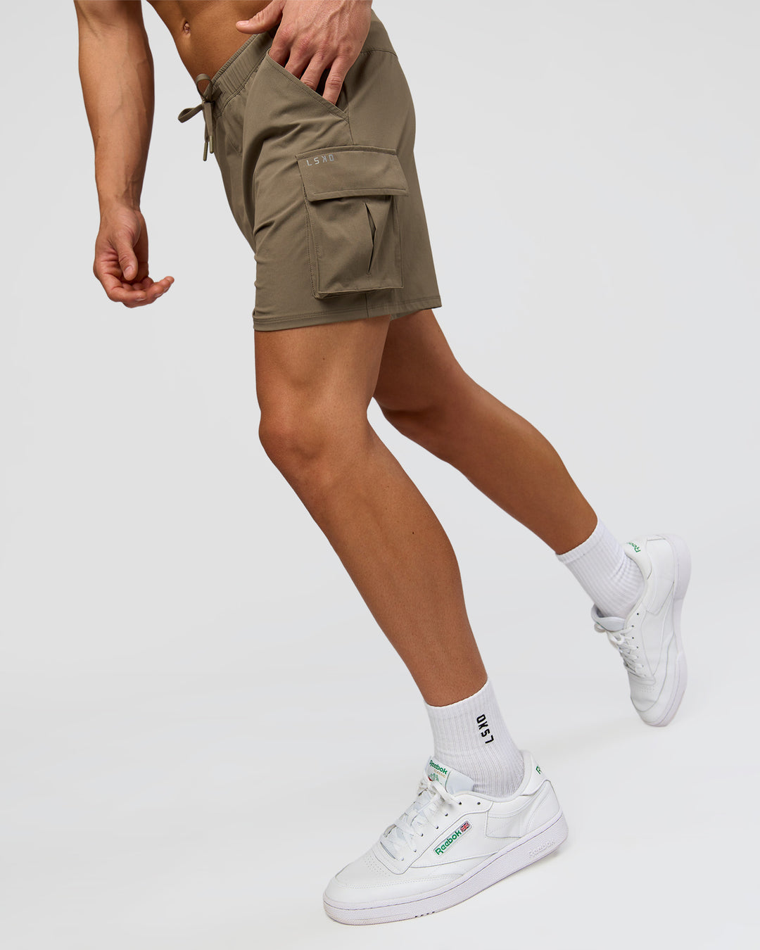 Man wearing Functional Cargo 6" Short - Walnut Grey | Model:Albert | Size:M