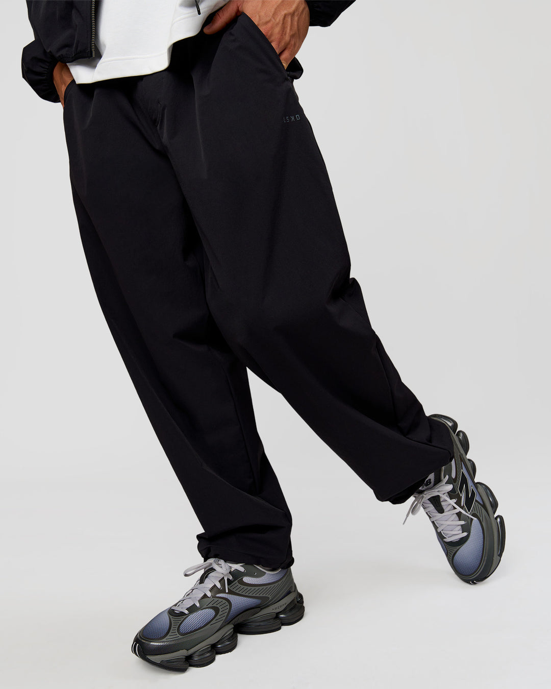 Man wearing Motion Wide Leg Pant - Black | Model:Albert | Size:M - view 11