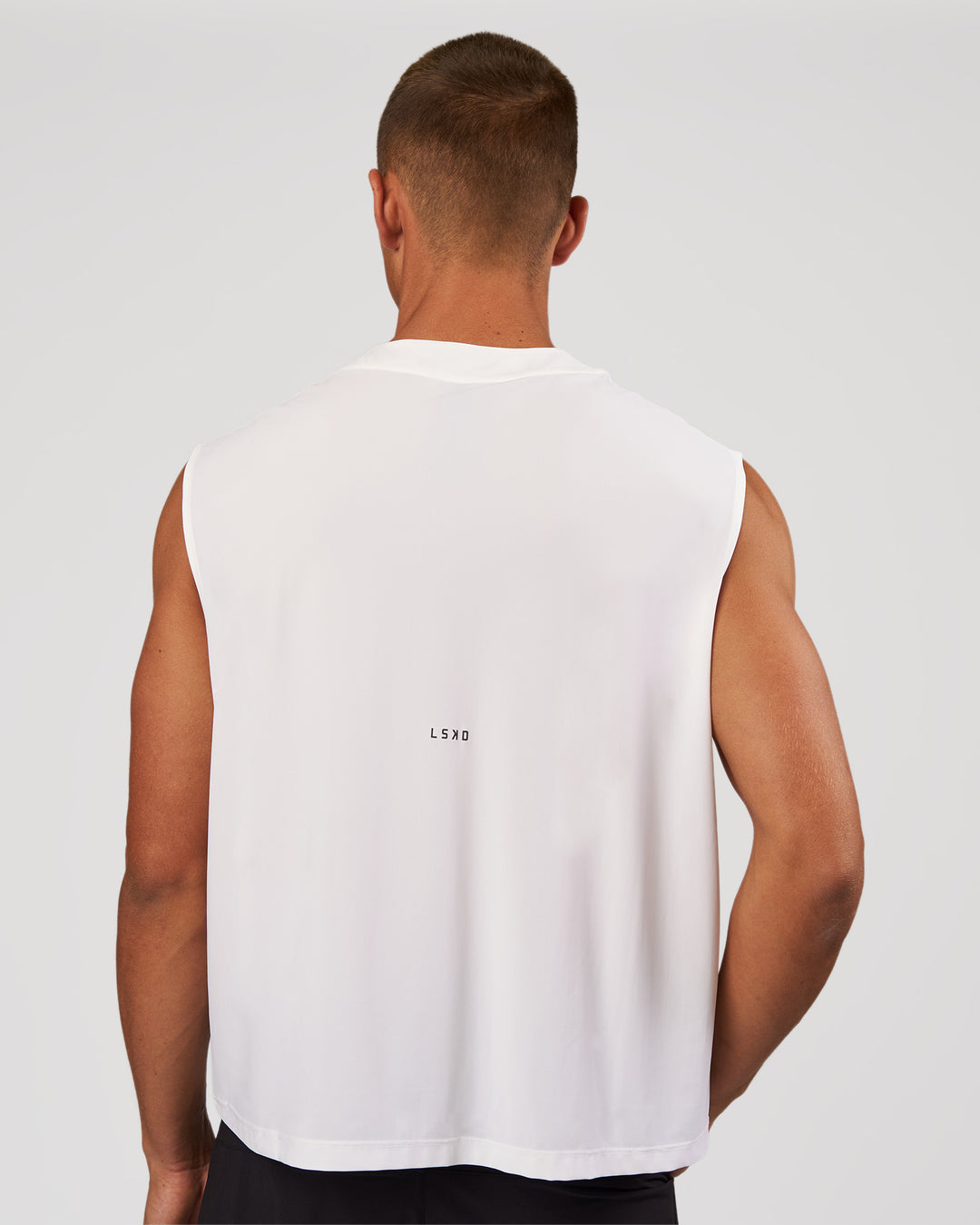 Man wearing Motionline Boxy Tank - White | Model:Albert | Size:M - view 6