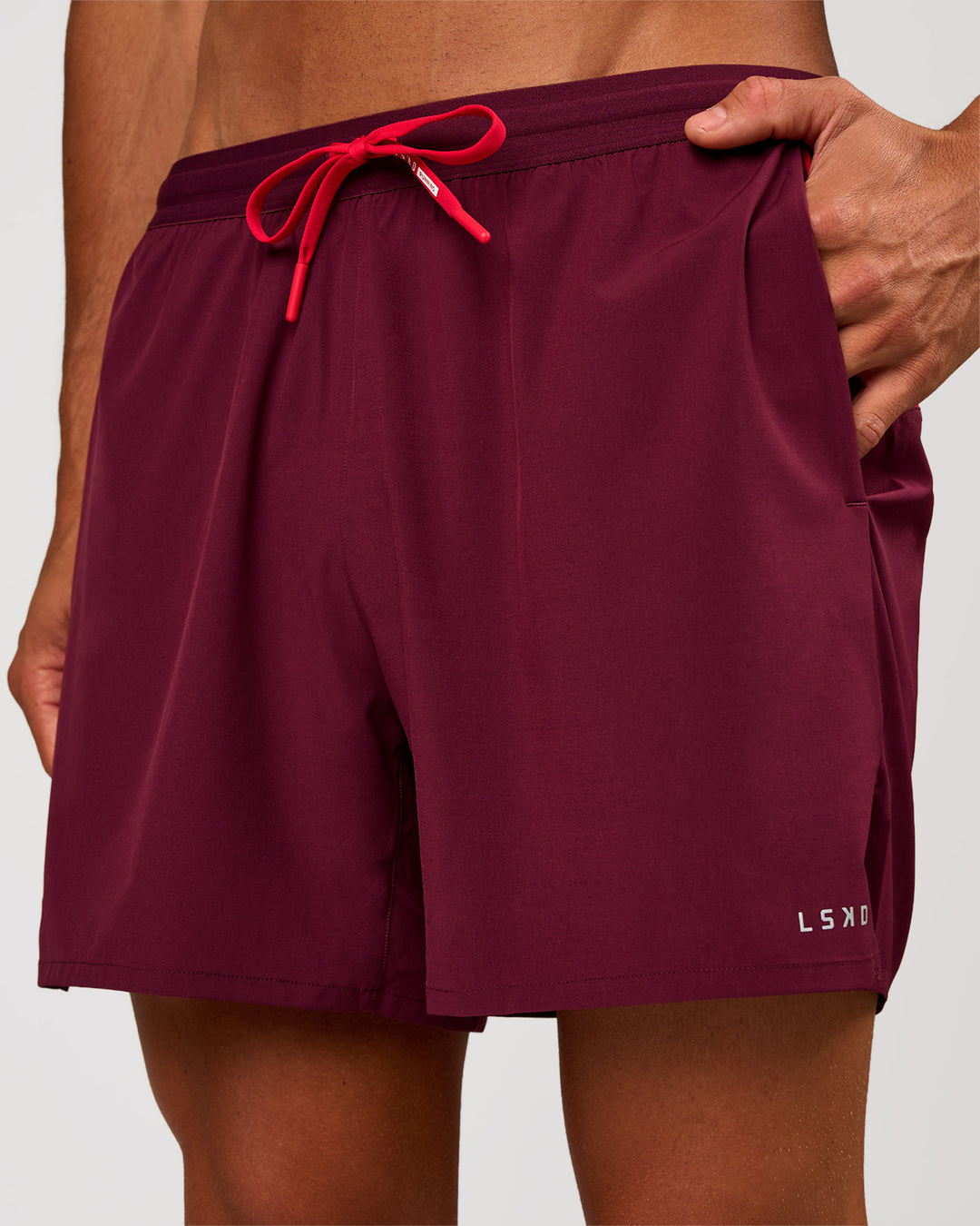 Man wearing Pace 5" Lined Running Short - Cherry Lacquer-Scarlet | Model:Albert | Size:M - view 2