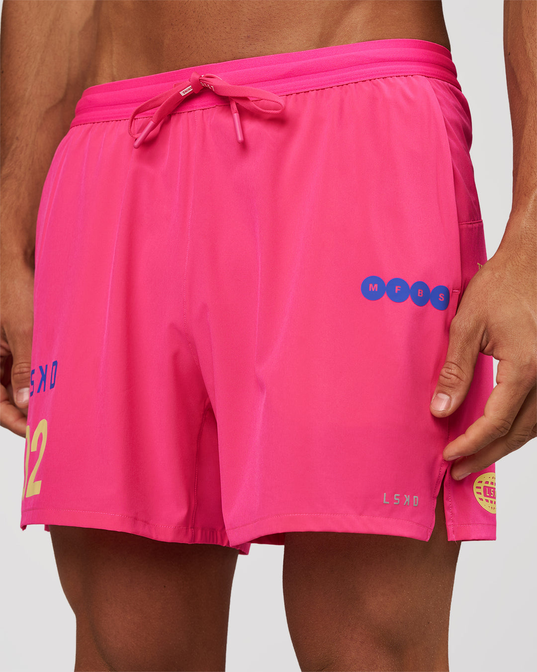 Man wearing Pace 5" Lined Running Short - Game Plan Ultra Pink | Model:Albert | Size:M - view 2