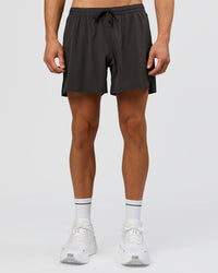 Man wearing Pace 5" Running Short - Black-Onyx | Model:Albert | Size:M