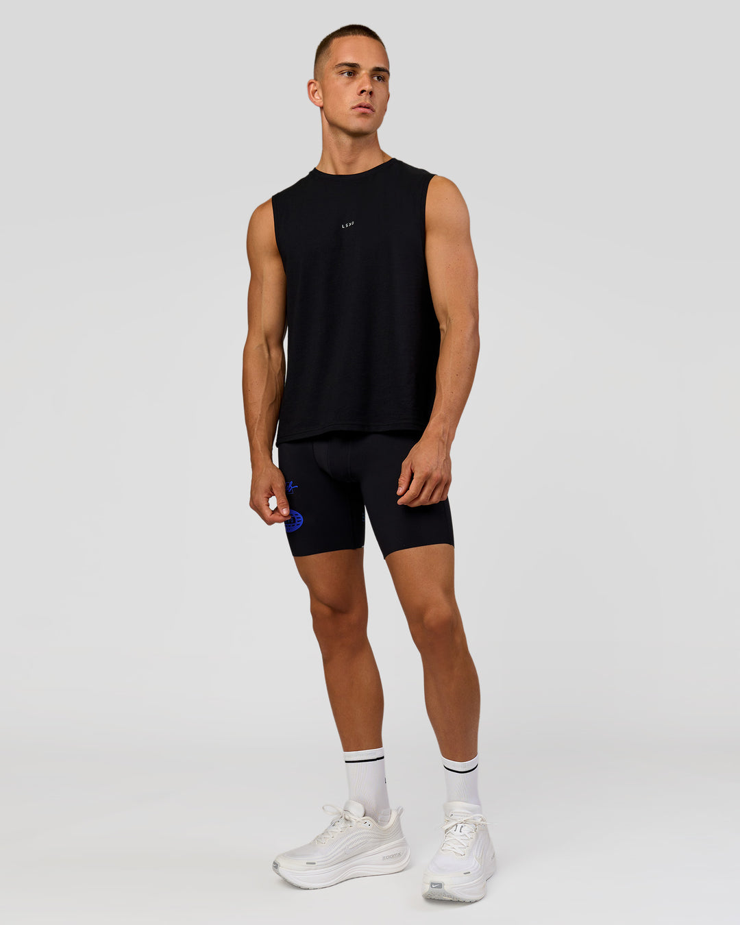 Man wearing Run Club FLXCotton Tank - Black-Electric Indigo | Model:Albert | Size:M