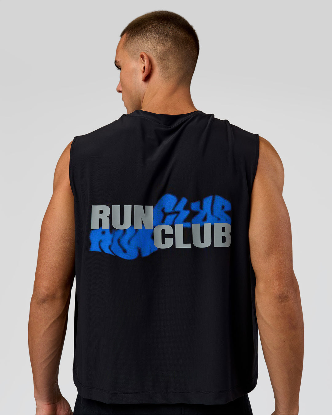 Man wearing Run Club Elevate Muscle Tank - Black-Electric Indigo | Model:Albert | Size:M