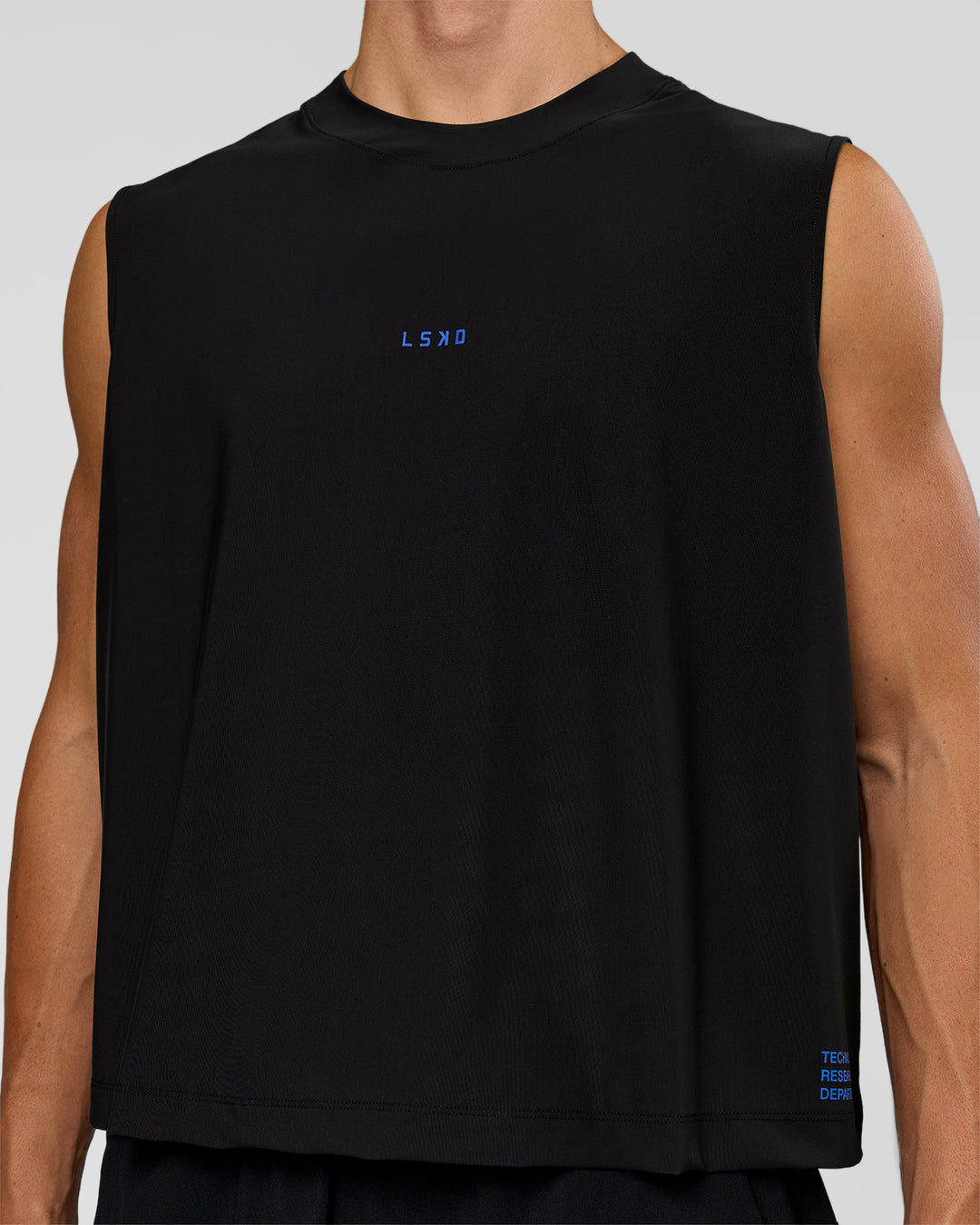 Man wearing Run Club Elevate Muscle Tank - Black-Electric Indigo | Model:Albert | Size:M
