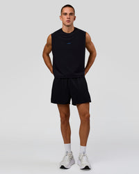Man wearing Run Club Elevate Muscle Tank - Black-Electric Indigo | Model:Albert | Size:M