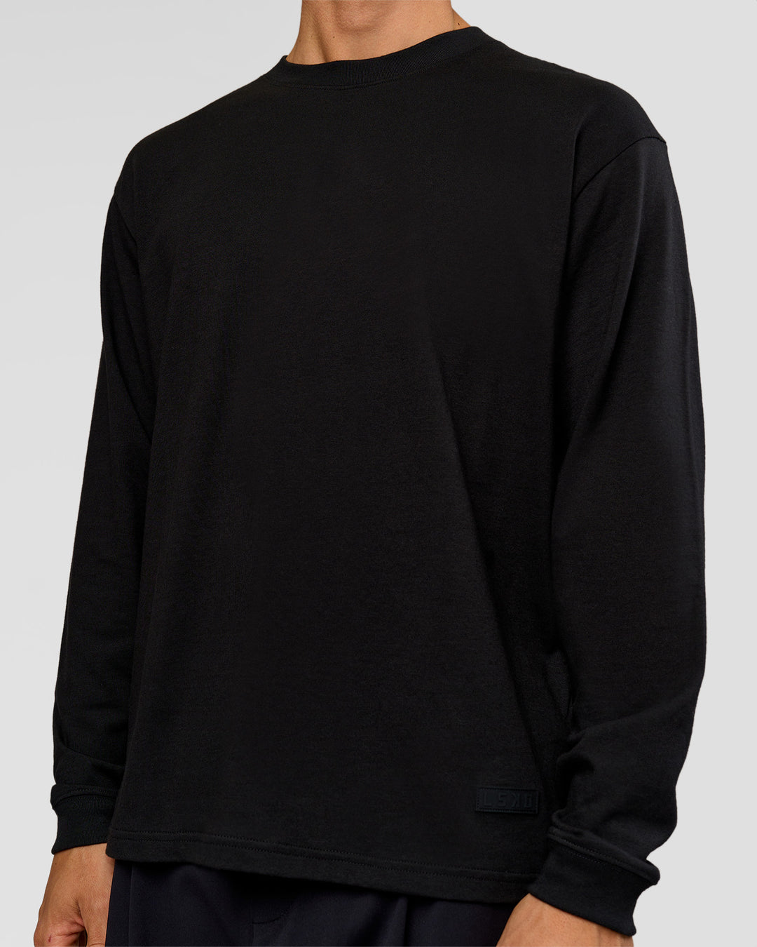 Man wearing Tonal Legacy Heavyweight Oversized LS Tee - Black-Black | Model:Albert | Size:M - view 3