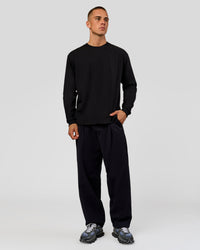 Man wearing Tonal Legacy Heavyweight Oversized LS Tee - Black-Black | Model:Albert | Size:M | Thumbnail Index: 3