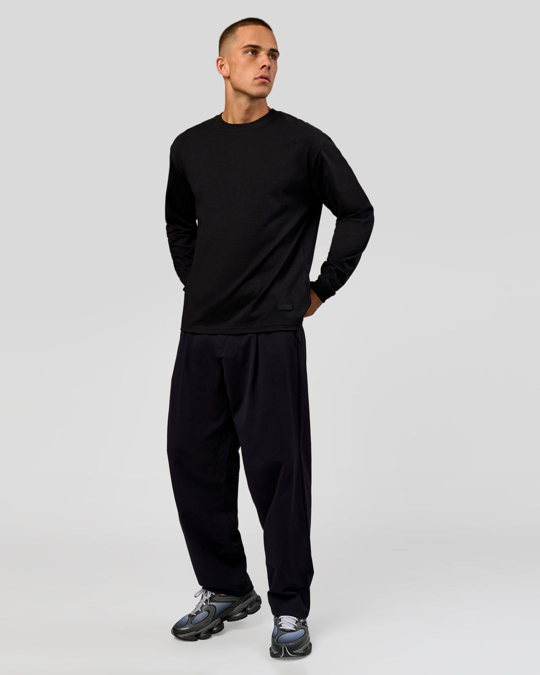 Man wearing Tonal Legacy Heavyweight Oversized LS Tee - Black-Black | Model:Albert | Size:M - view 5