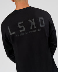 Man wearing Tonal Legacy Heavyweight Oversized LS Tee - Black-Black | Model:Albert | Size:M | Thumbnail Index: 6