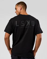 Man wearing Tonal Legacy Heavyweight Oversized Tee - Black-Black | Model:Albert | Size:M | Thumbnail Index: 1