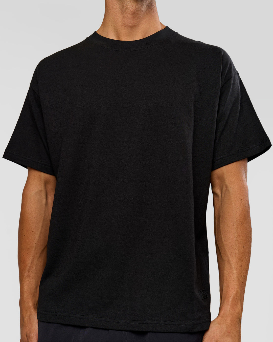 Man wearing Tonal Legacy Heavyweight Oversized Tee - Black-Black | Model:Albert | Size:M - view 5
