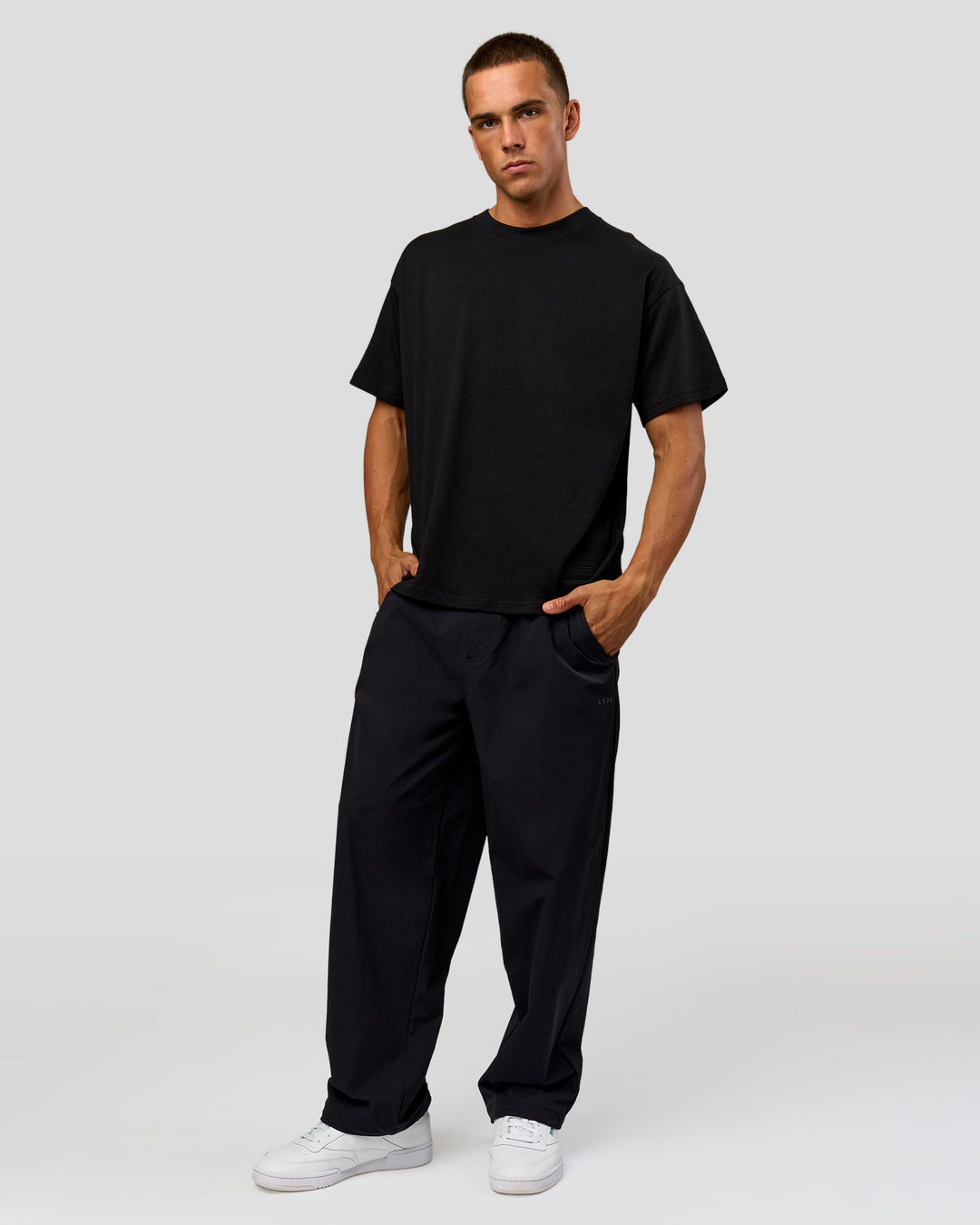 Man wearing Tonal Legacy Heavyweight Oversized Tee - Black-Black | Model:Albert | Size:M - view 14