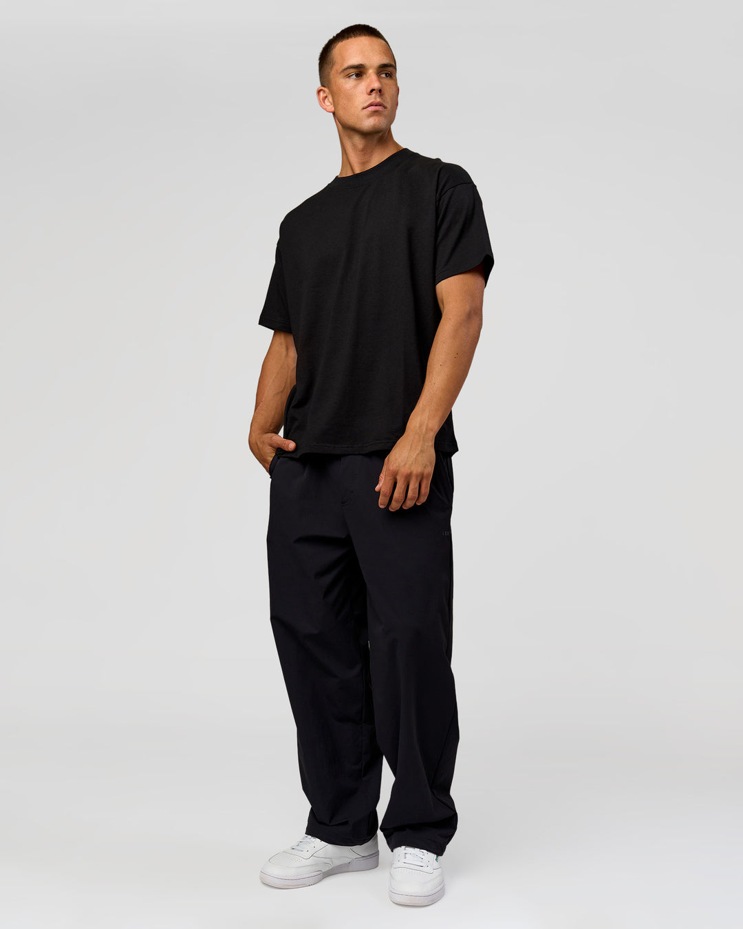 Man wearing Tonal Legacy Heavyweight Oversized Tee - Black-Black | Model:Albert | Size:M - view 16