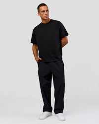 Man wearing Tonal Legacy Heavyweight Oversized Tee - Black-Black | Model:Albert | Size:M | Thumbnail Index: 16