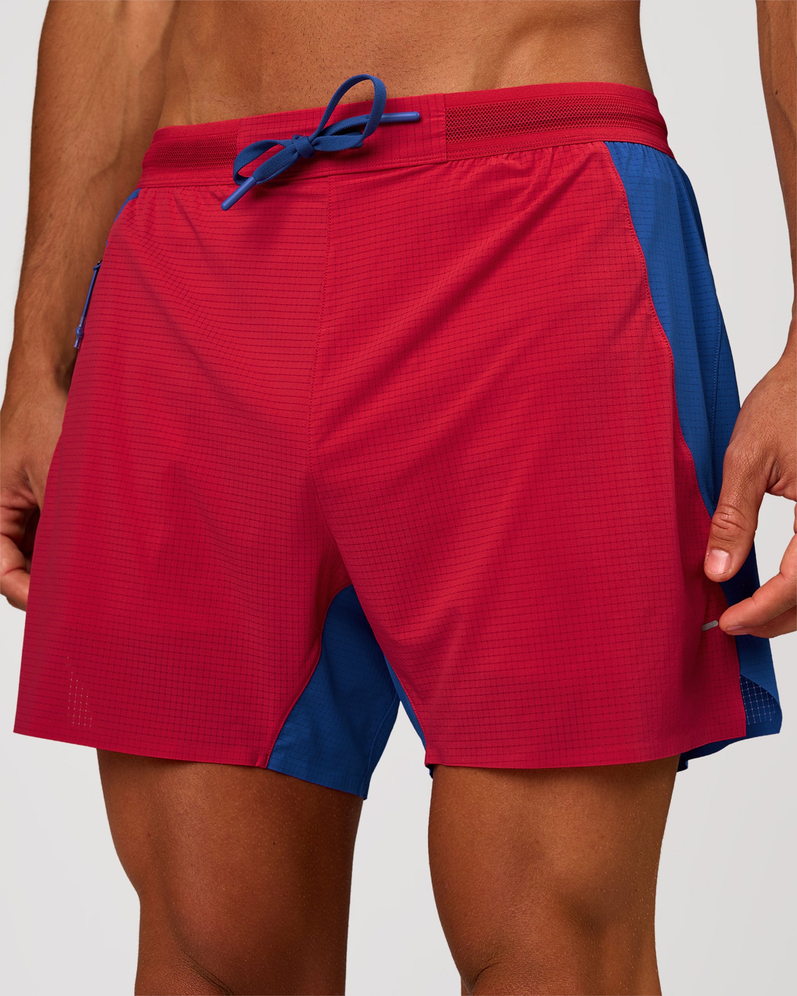 Man wearing UltraAir 5" Lined Performance Short - Scarlet-Electric Indigo | Model: Albert | Size: M