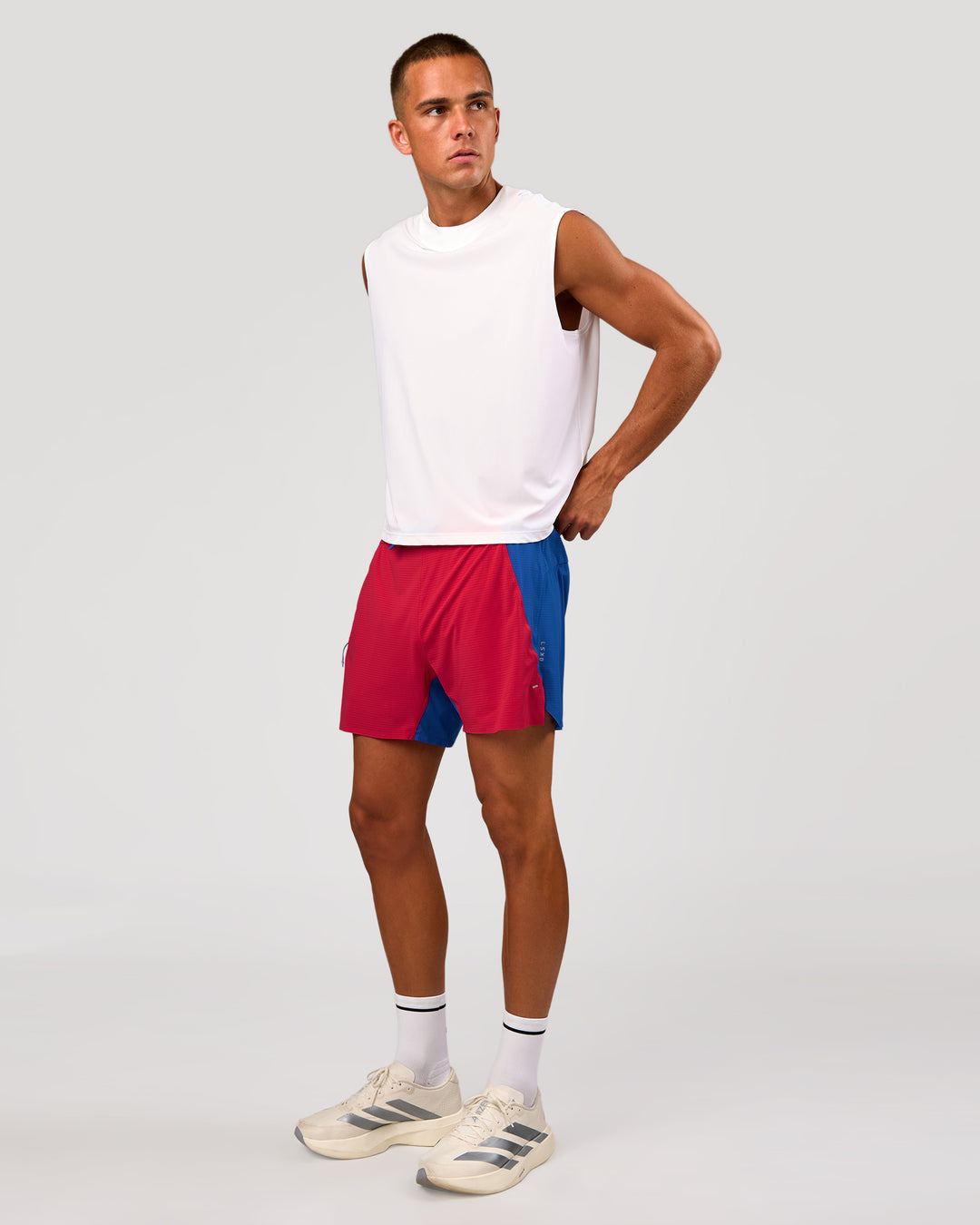 Man wearing UltraAir 5" Lined Performance Short - Scarlet-Electric Indigo | Model: Albert | Size: M - view 8