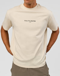 Man wearing VS1 Enjoy The Journey FLXCotton Oversize Tee - Vanilla Bean | Model:Albert | Size:M | Thumbnail Index: 1