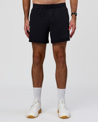 Man wearing Rep+ 5” Training Short - Black | Model:Alex | Size:M