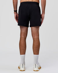 Man wearing Rep+ 5” Training Short - Black | Model:Alex | Size:M