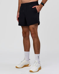 Man wearing Rep+ 5” Training Short - Black | Model:Alex | Size:M