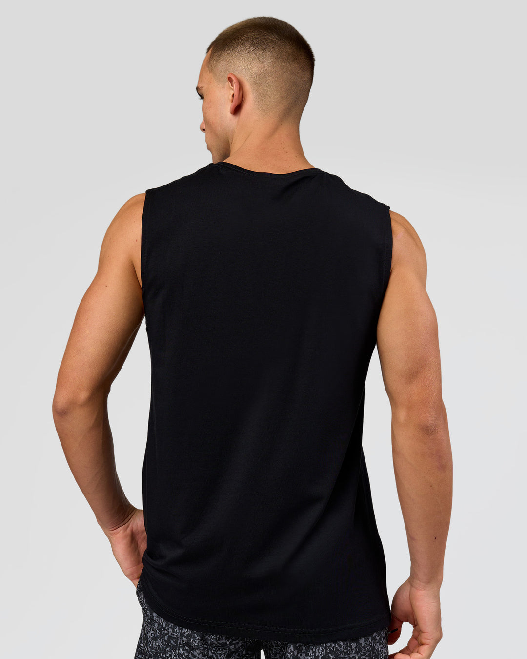 Man wearing Base FLXCotton Tank - Black | Model:Base | Size:M - view 2