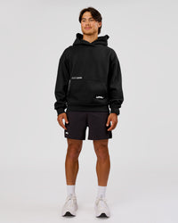 Man wearing Movember x LSKD Oversized Hoodie - Black | Model:George | Size:M | Thumbnail Index: 16