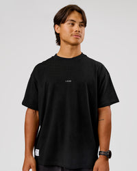 Man wearing VS26 Journey FLXCotton Oversize Tee - Black-White | Model:George | Size:M | Thumbnail Index: 8