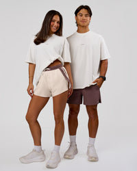 Man wearing Run Club Unisex Oversized Heavyweight FLXCotton Tee - Off White | Model:George | Size:M | Thumbnail Index: 9