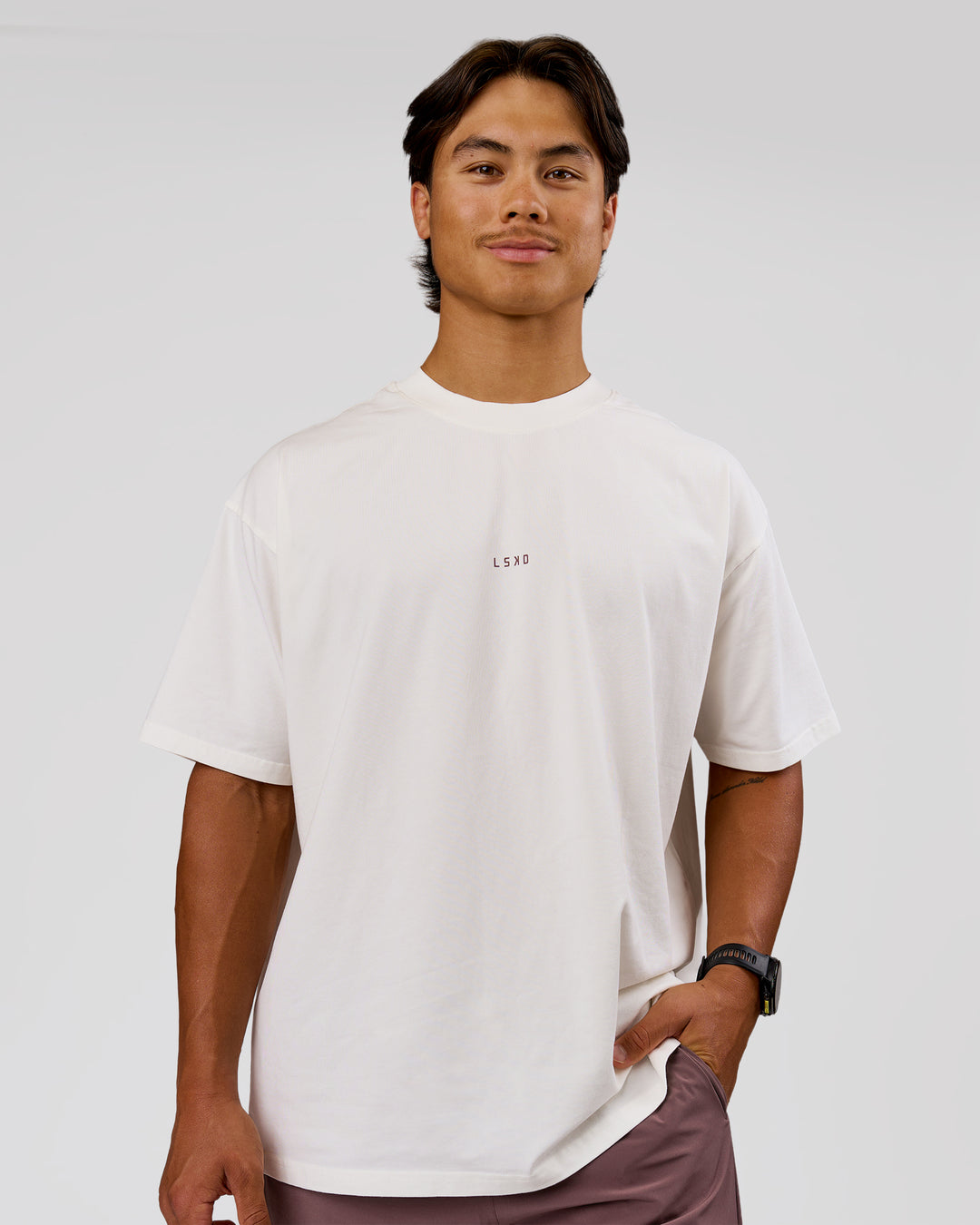 Man wearing Run Club Unisex Oversized Heavyweight FLXCotton Tee - Off White | Model:George | Size:M - view 4