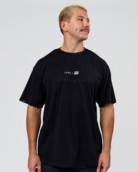 Man wearing Deadly Runners Run Club FLXCotton Oversize Tee - Black | Model:Jaiden | Size:M | Thumbnail Index: 5