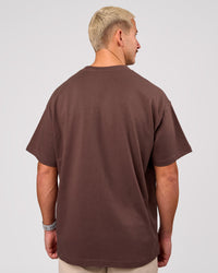 Man wearing Varsity EST Heavyweight Oversized Tee  - Cocoa Powder-Off White | Model:Jaiden | Size:M | Thumbnail Index: 2