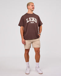 Man wearing Varsity EST Heavyweight Oversized Tee  - Cocoa Powder-Off White | Model:Jaiden | Size:M | Thumbnail Index: 4