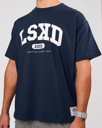 Man wearing Varsity EST Heavyweight Oversized Tee  - Future Navy-White | Model:Jaiden | Size:M | Thumbnail Index: 8
