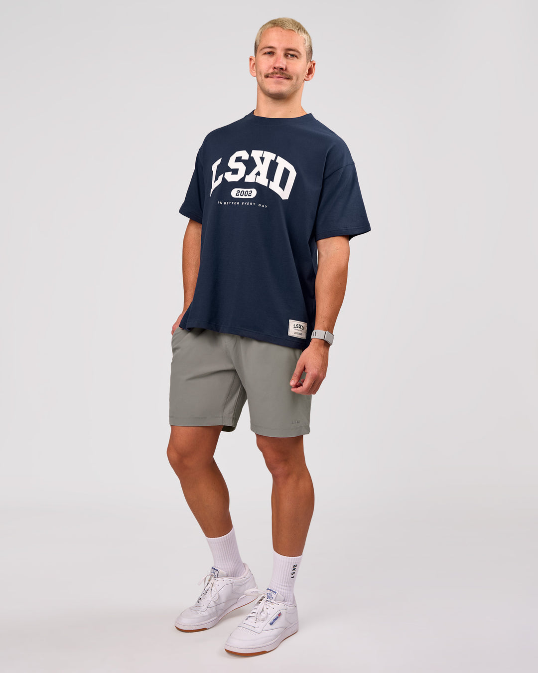 Man wearing Varsity EST Heavyweight Oversized Tee  - Future Navy-White | Model:Jaiden | Size:M - view 11