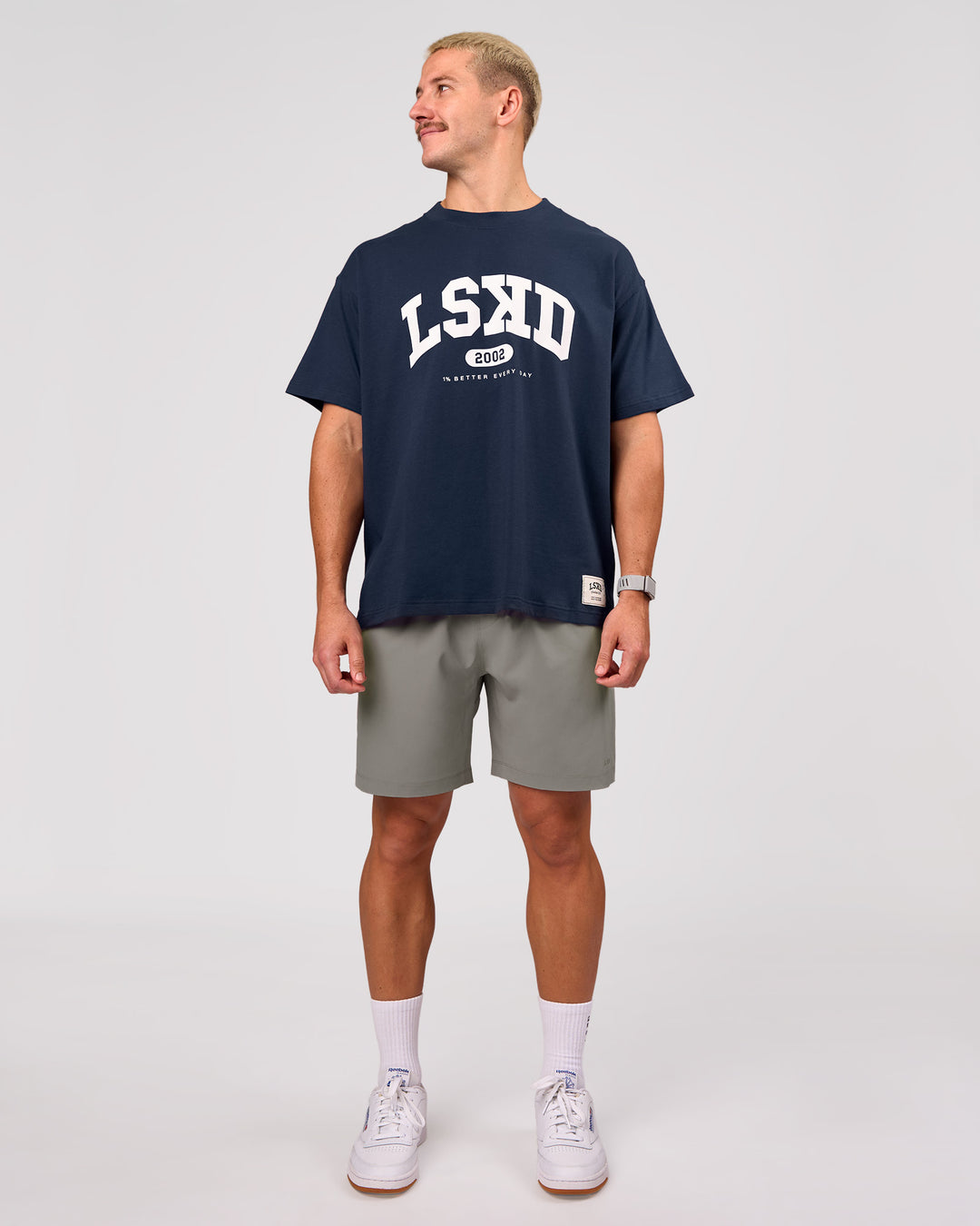 Man wearing Varsity EST Heavyweight Oversized Tee  - Future Navy-White | Model:Jaiden | Size:M - view 12