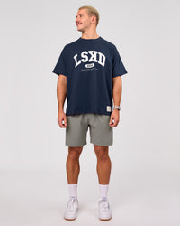 Man wearing Varsity EST Heavyweight Oversized Tee  - Future Navy-White | Model:Jaiden | Size:M | Thumbnail Index: 11