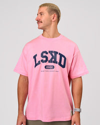 Man wearing Varsity EST Heavyweight Oversized Tee  - Pink Rose-Future Navy | Model:Jaiden | Size:M | Thumbnail Index: 7