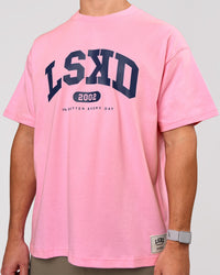 Man wearing Varsity EST Heavyweight Oversized Tee  - Pink Rose-Future Navy | Model:Jaiden | Size:M | Thumbnail Index: 9