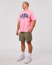 Man wearing Varsity EST Heavyweight Oversized Tee  - Pink Rose-Future Navy | Model:Jaiden | Size:M | Thumbnail Index: 10