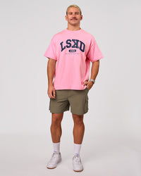 Man wearing Varsity EST Heavyweight Oversized Tee  - Pink Rose-Future Navy | Model:Jaiden | Size:M | Thumbnail Index: 11
