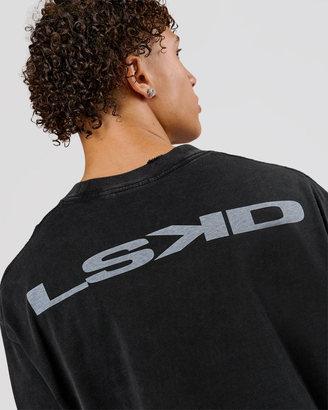 Man wearing Backline Washed Heavyweight Oversized LS Tee - Black Washed | Model:Leandro | Size:M - view 7