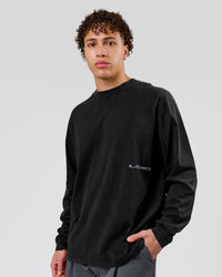 Man wearing Backline Washed Heavyweight Oversized LS Tee - Black Washed | Model:Leandro | Size:M | Thumbnail Index: 8