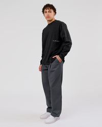 Man wearing Backline Washed Heavyweight Oversized LS Tee - Black Washed | Model:Leandro | Size:M | Thumbnail Index: 10