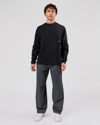Man wearing Backline Washed Heavyweight Oversized LS Tee - Black Washed | Model:Leandro | Size:M | Thumbnail Index: 14