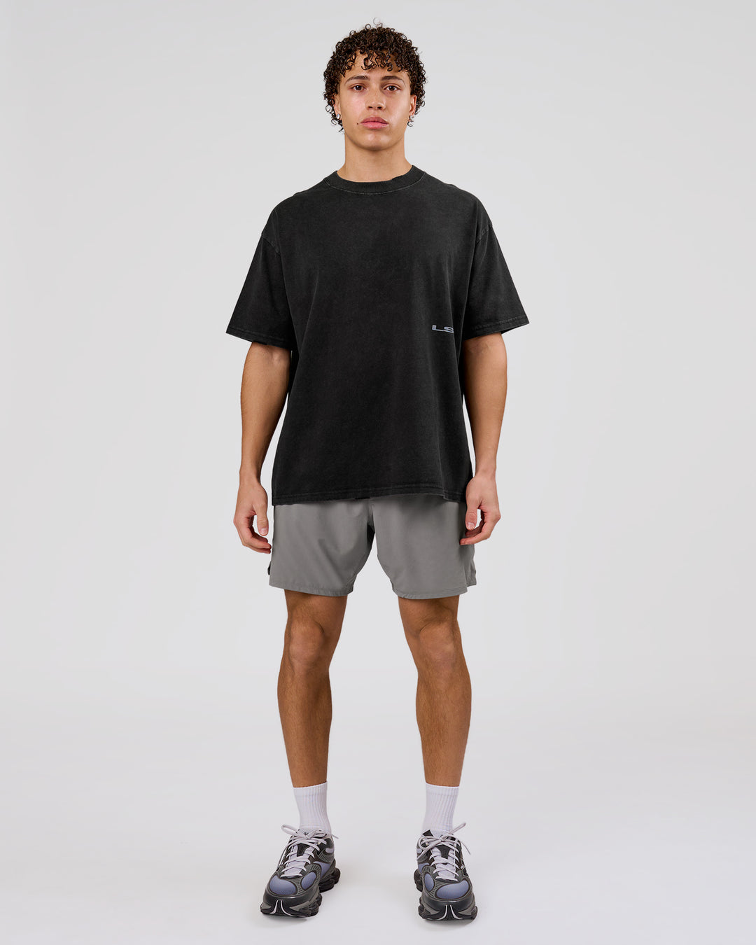 Man wearing Backline Washed Heavyweight Oversized Tee - Black Washed | Model:Leandro | Size:M - view 10