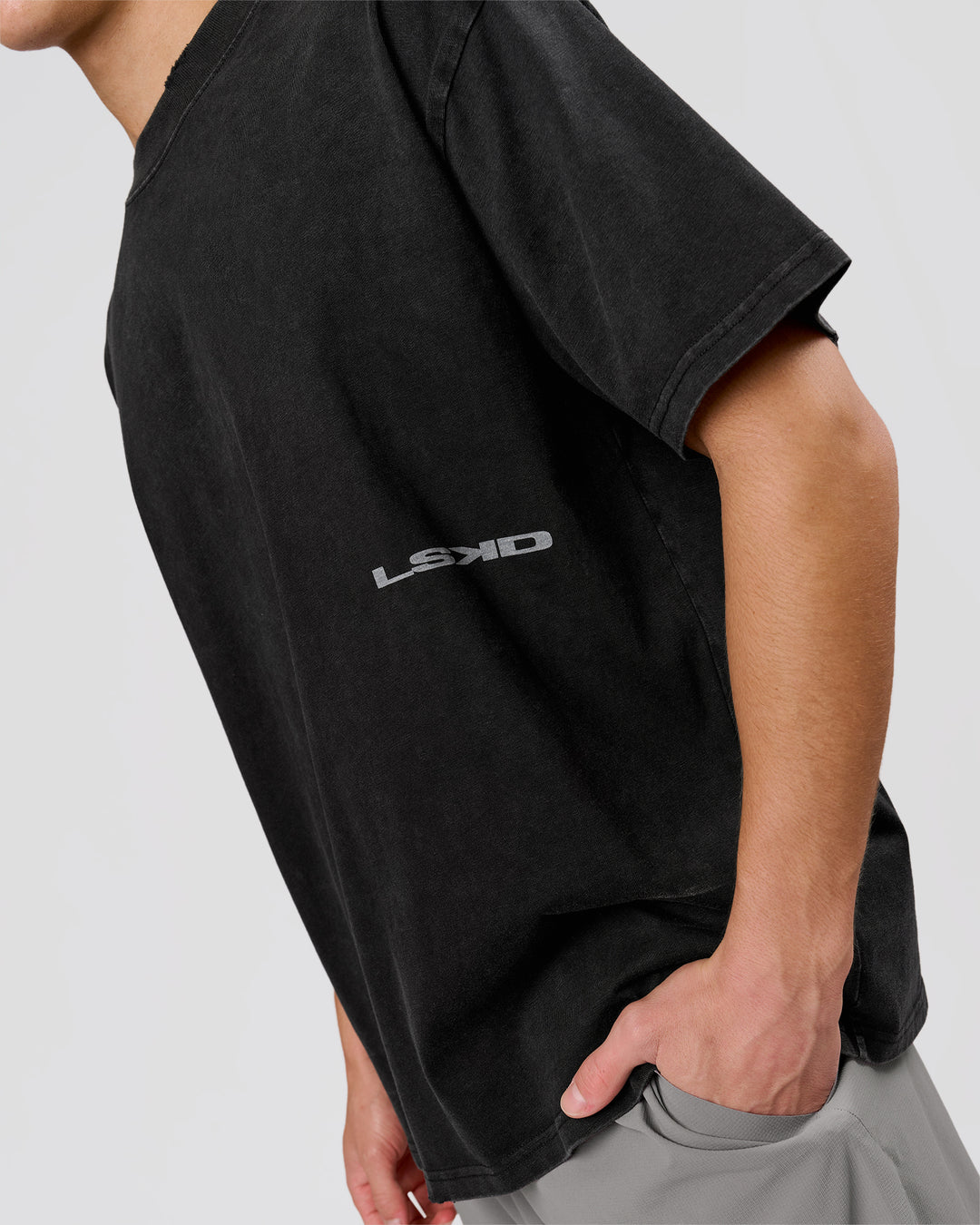 Man wearing Backline Washed Heavyweight Oversized Tee - Black Washed | Model:Leandro | Size:M - view 17