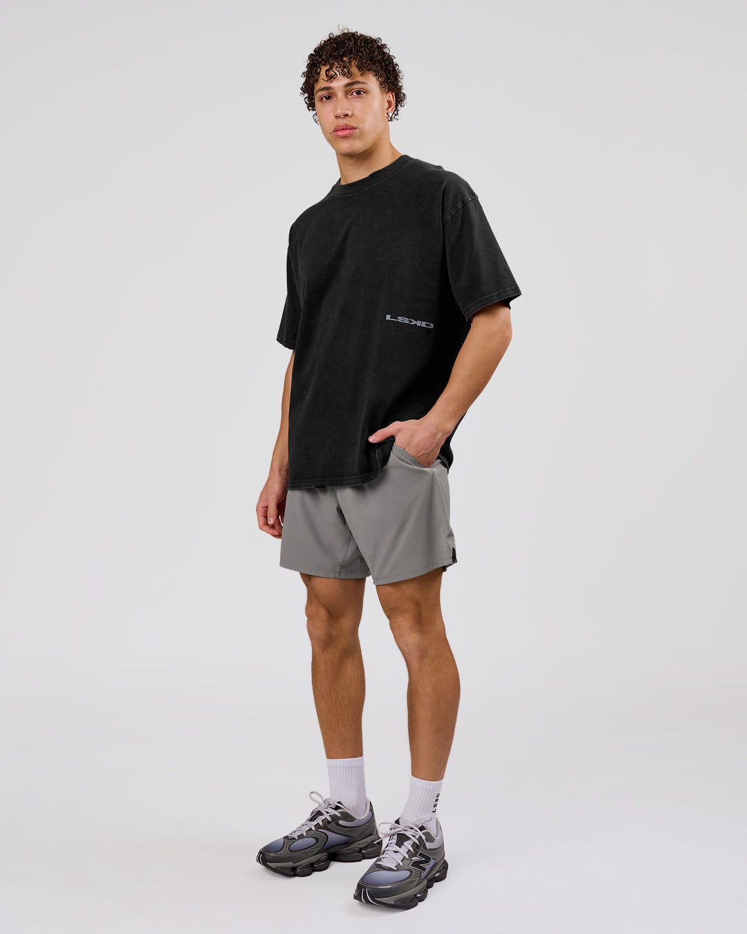 Man wearing Backline Washed Heavyweight Oversized Tee - Black Washed | Model:Leandro | Size:M - view 19