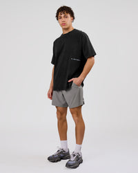 Man wearing Backline Washed Heavyweight Oversized Tee - Black Washed | Model:Leandro | Size:M | Thumbnail Index: 18